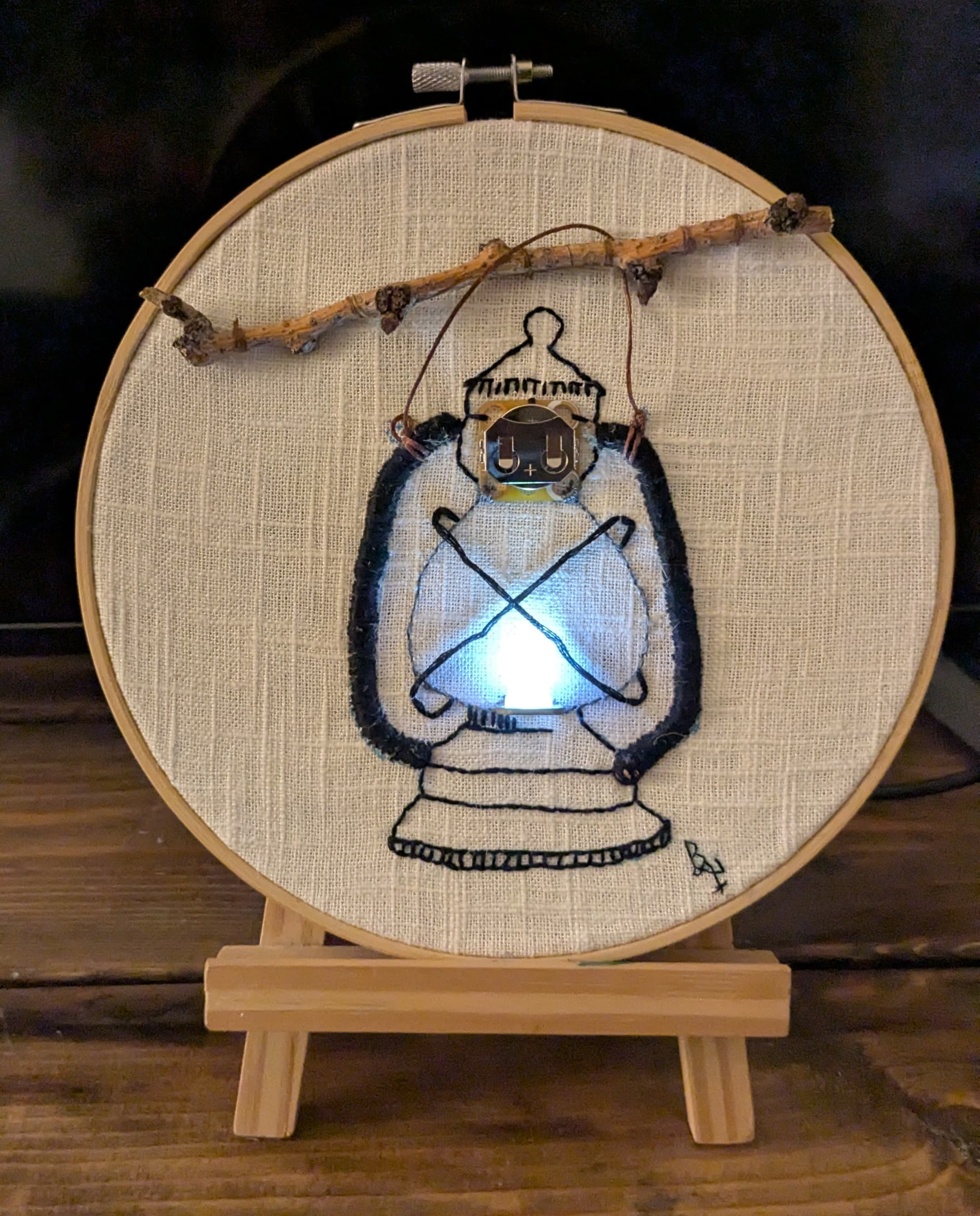 Embroidery of a lantern using LED and conductive thread on cloth