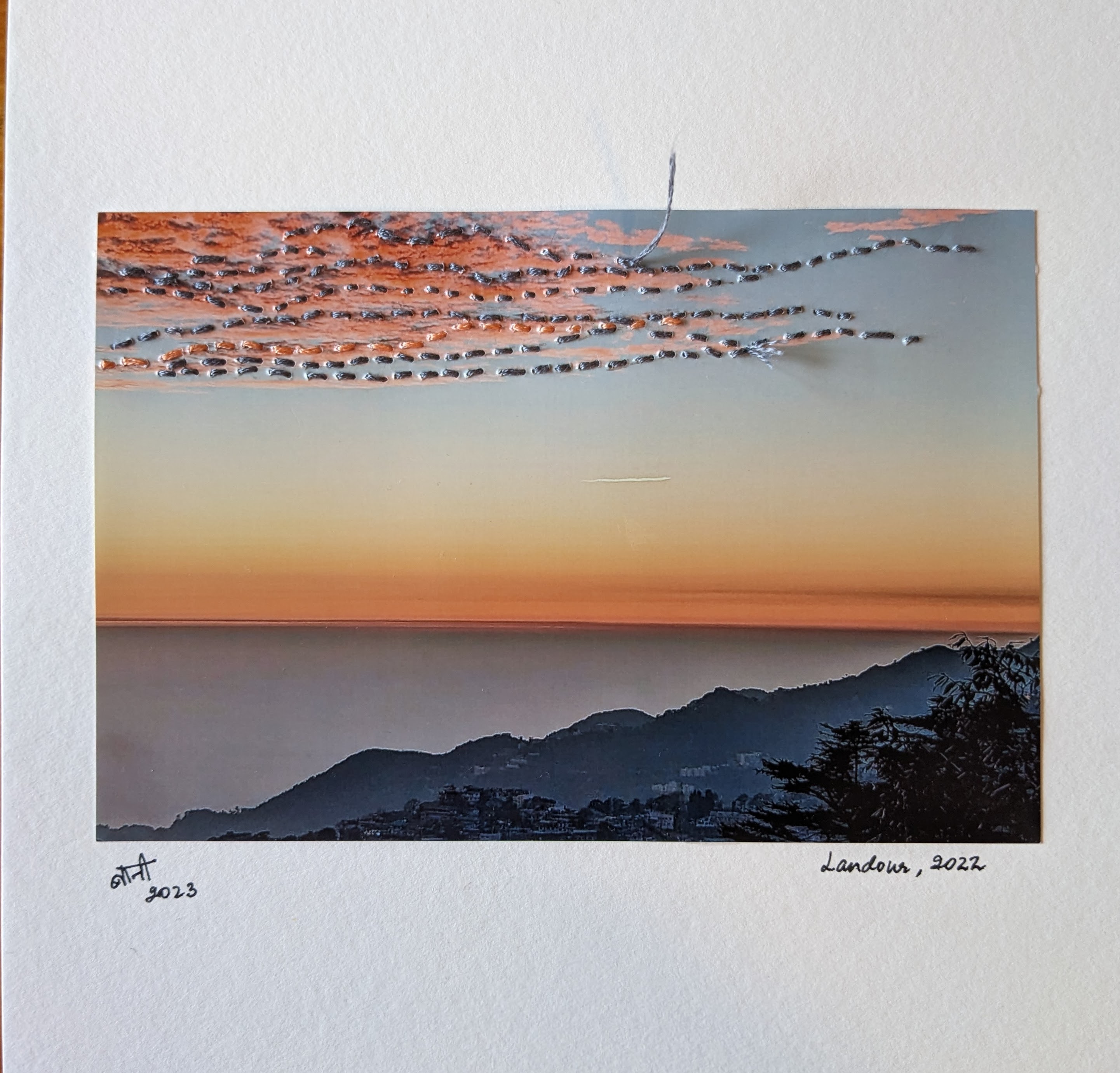 Photo embroidery on a sky photo using threads